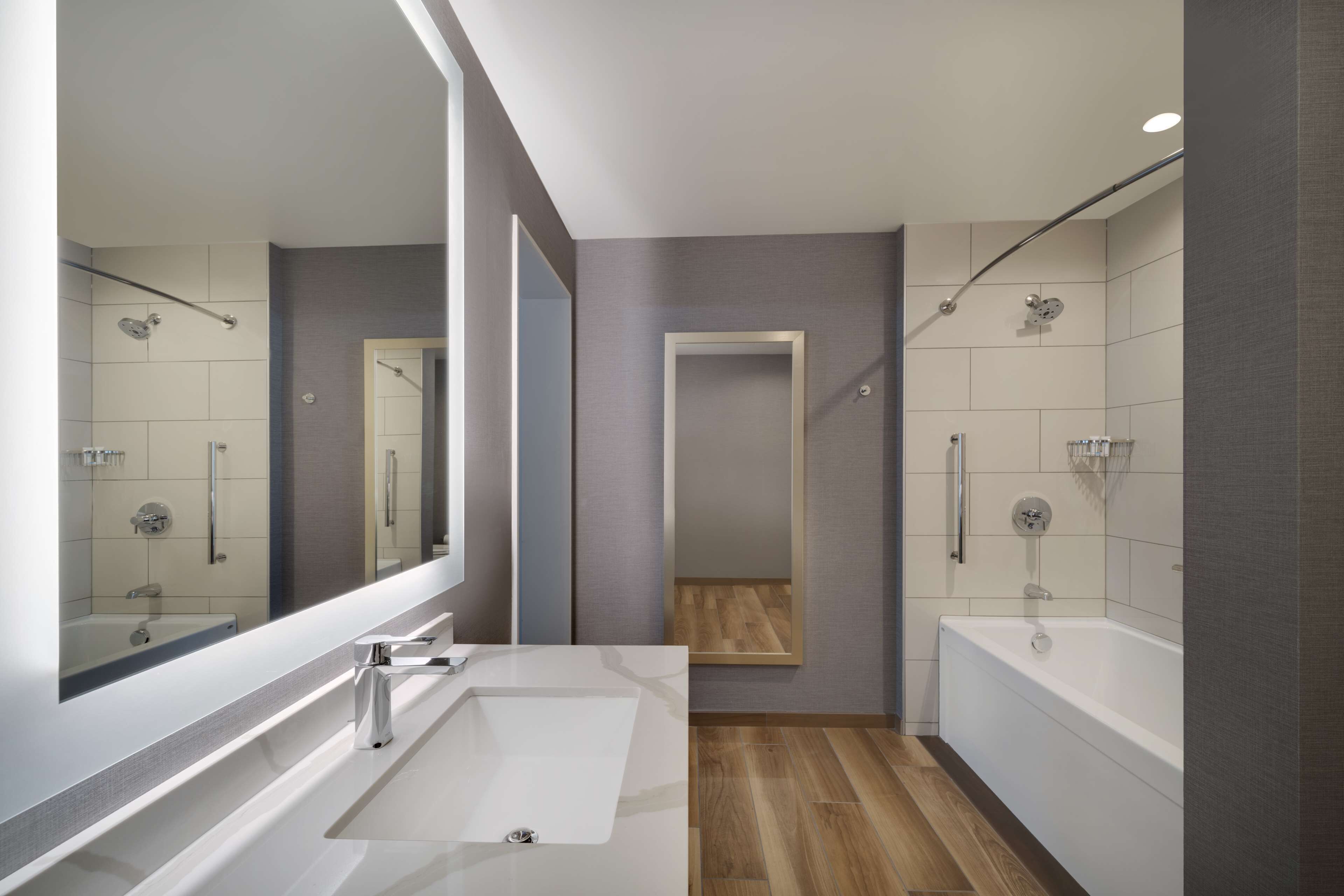 designer toiletries, hair dryer, towels, soap