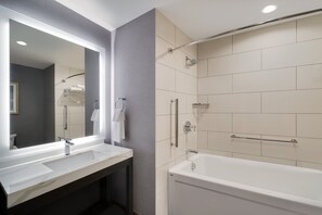 A modern bathroom with two sinks, a bathtub, and a shower. - Hyatt House LAX/Century Blvd (Los Angeles)