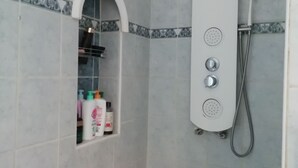 A shower with a handheld showerhead and a handheld shower attachment. - Quiet house near Nice (Contes)