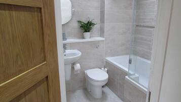 Riverside Gem | Bathroom | Combined shower/tub, hair dryer, towels, soap