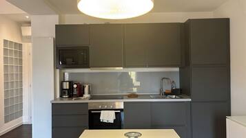 Apartment, 2 Bedrooms | Private kitchen | Fridge, microwave, stovetop, dishwasher