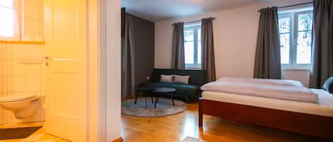 Deluxe Double Room, Mountain View | Living room | 80-cm flat-screen TV with cable channels, TV, heated floors