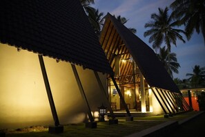 A modern building with a sloped roof and a large entrance. - Soluna Beach Resort (Marawila)