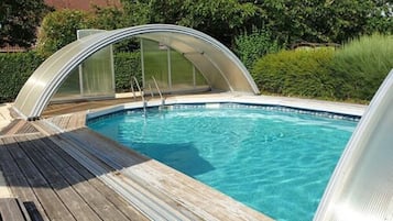Seasonal outdoor pool, pool umbrellas, pool loungers