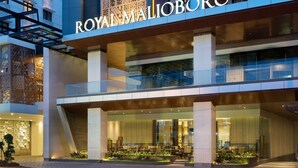 A modern hotel with a prominent sign reading "ROYAL MALIBORO". - Royal Malioboro Yogyakarta by Aston (Yogyakarta)
