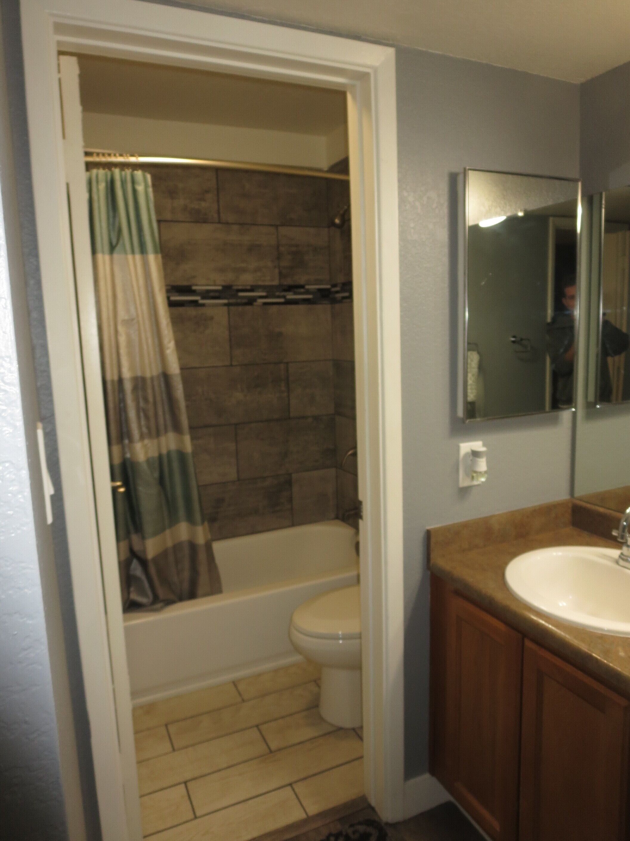 Combined shower/tub, hair dryer, towels, soap