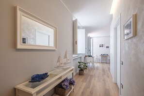 Stroll down the hallway to a dining area with a beautifully set table.