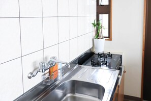 Fridge, microwave, stovetop, cookware/dishes/utensils