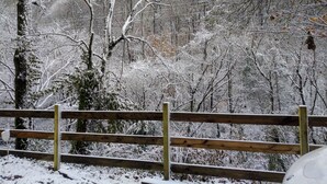 A wooden fence with snow-covered trees in the background. - Remodeled Vacation Home in the Mountains - Upstairs Balconies, Patios &... (Corryton)