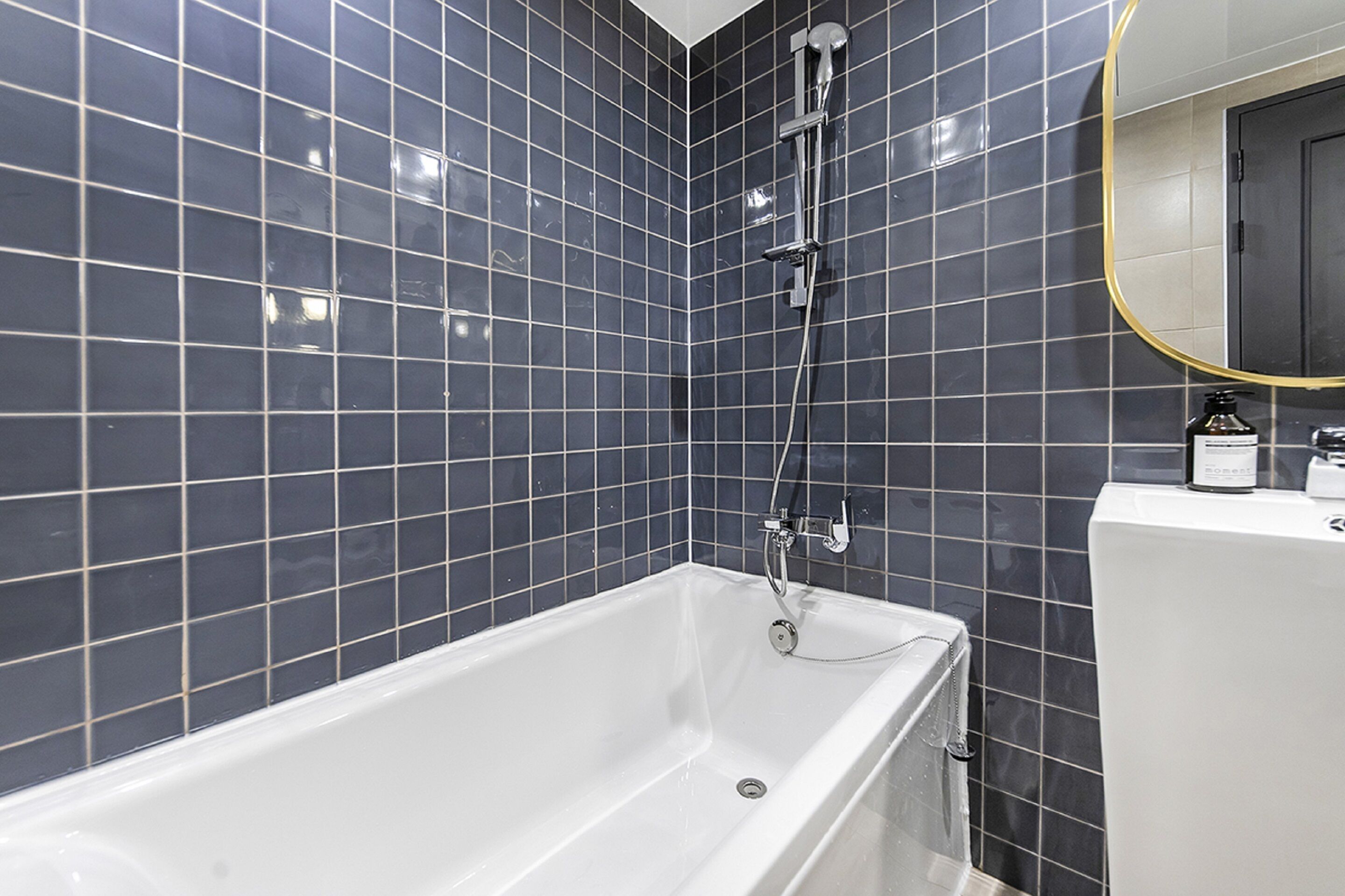 designer toiletries, hair dryer, bathrobes, slippers