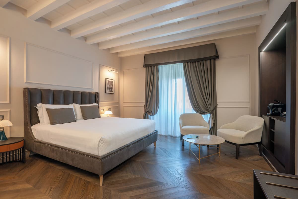 Deluxe Junior Suite (River view) | Frette Italian sheets, premium bedding, Select Comfort beds, minibar