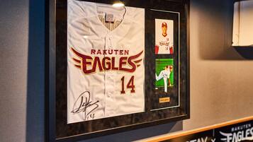 A framed baseball jersey with the Rakuten Eagles logo and number 14.