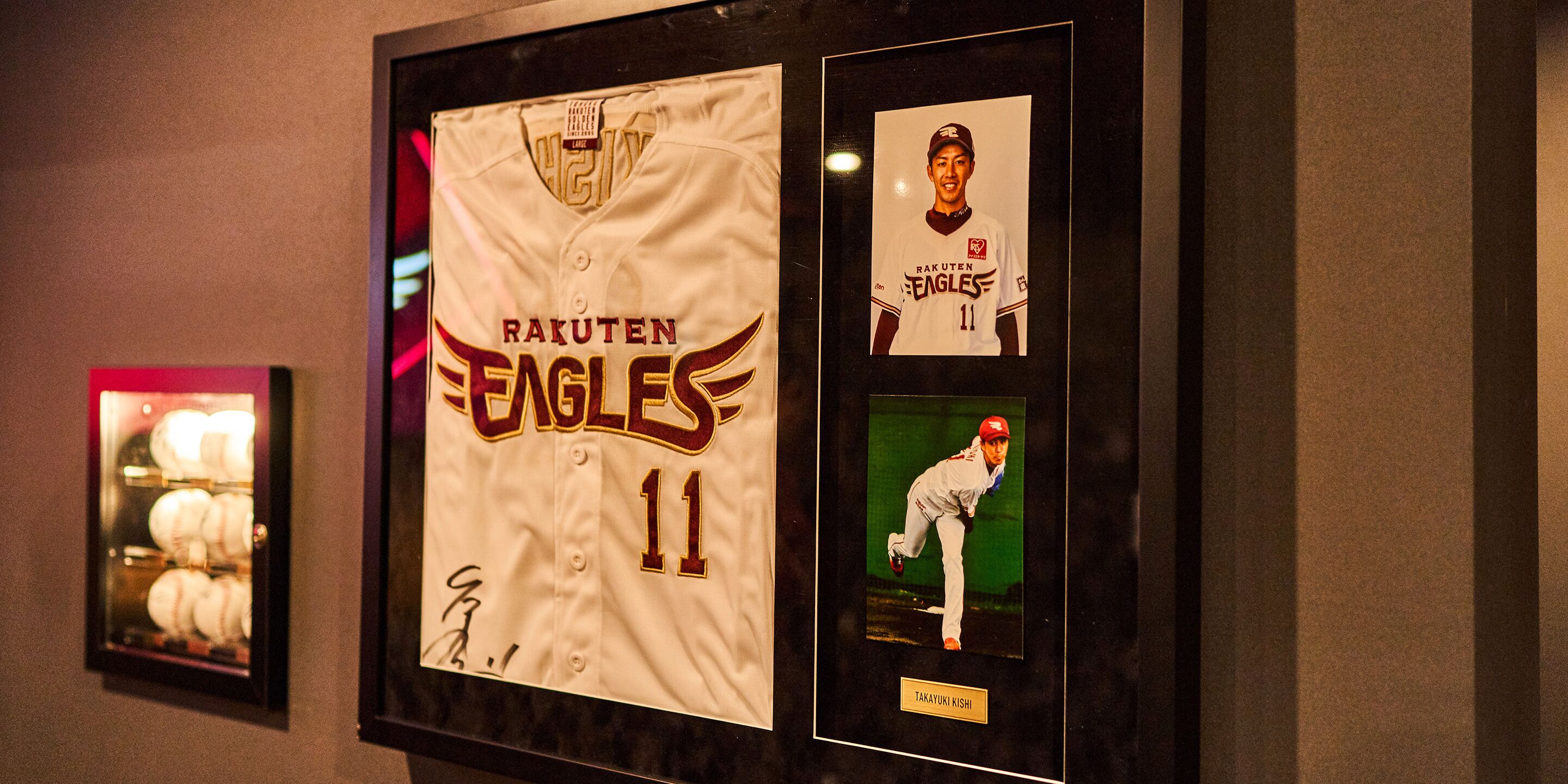 A framed baseball jersey with the name "RAKUTEN EAGLES" and the number "11".