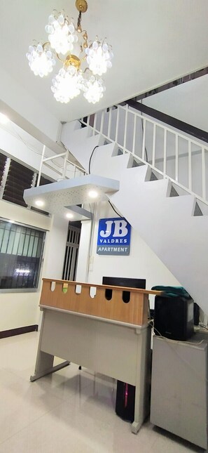 A staircase with a sign indicating 'JB Apartments'. - JB Valdres Apartment (Parañaque)