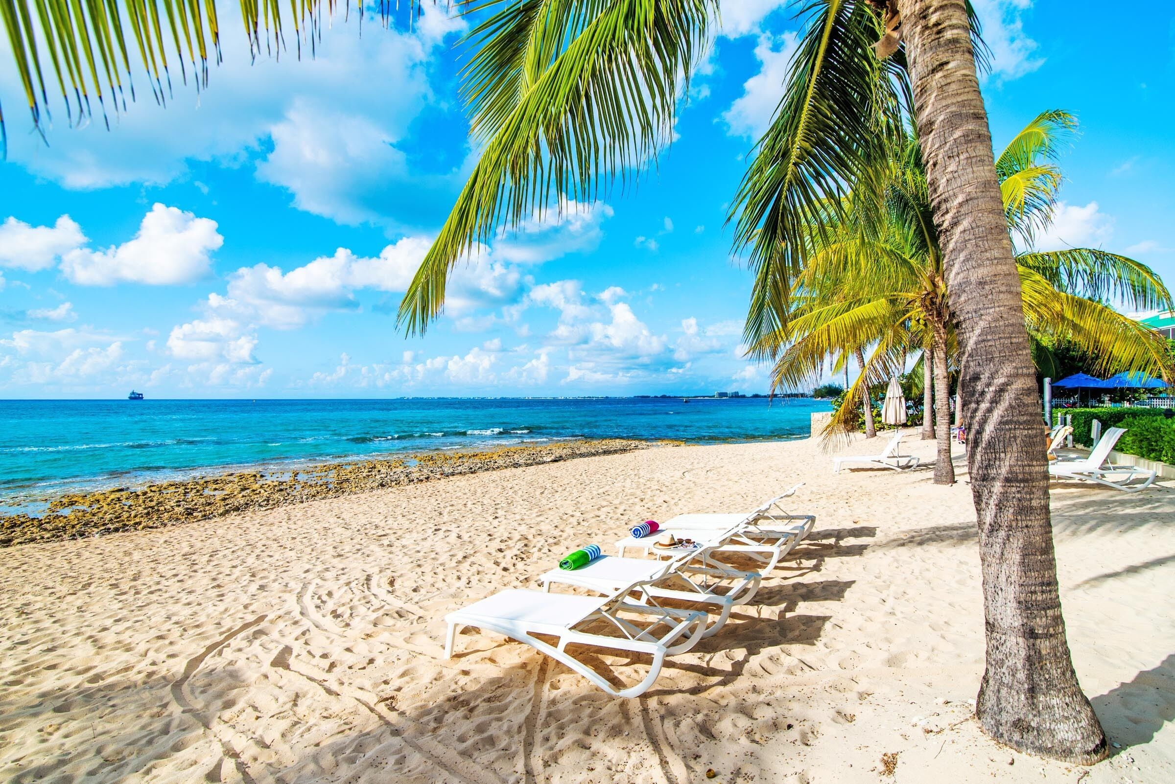 On the beach, sun-loungers, beach towels