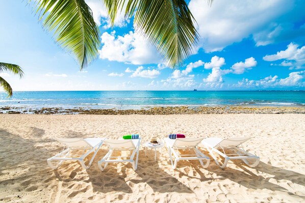 On the beach, sun loungers, beach towels