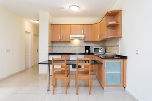 Apartment, 2 Bedrooms | Private kitchen | Mini-fridge, microwave, oven, coffee/tea maker