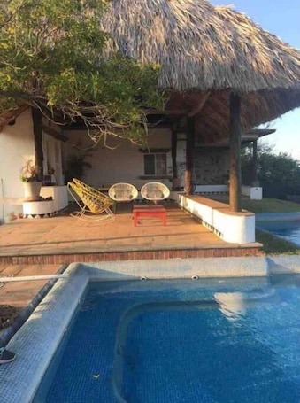 Outdoor pool. SUITES LAM BEACH HOUSE Panoramic views.