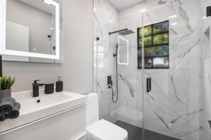 Bathtub, hair dryer, towels, soap