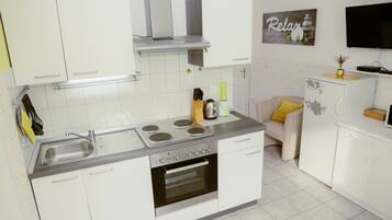 Comfort Apartment, 2 Bedrooms | Private kitchen | Fridge, microwave, stovetop, coffee/tea maker