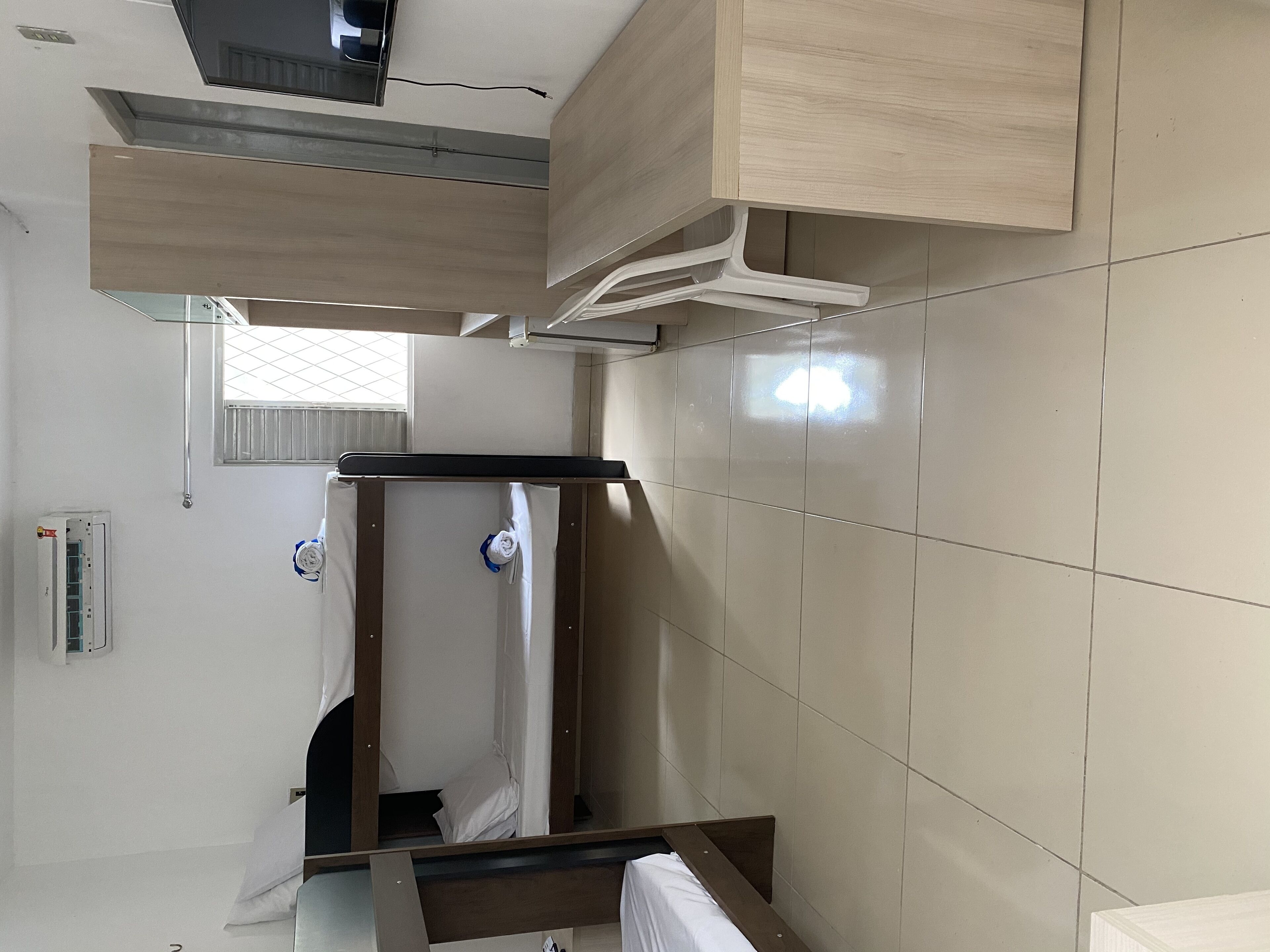 Basic Quadruple Room | Minibar, in-room safe, desk, iron/ironing board