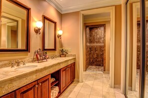 Elite Suite | Bathroom | Shower, hydromassage showerhead, designer toiletries, hair dryer