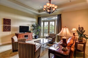 Luxury Suite | Living area | Flat-screen TV