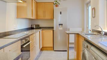 Oven, dishwasher, high chair, cookware/dishes/utensils