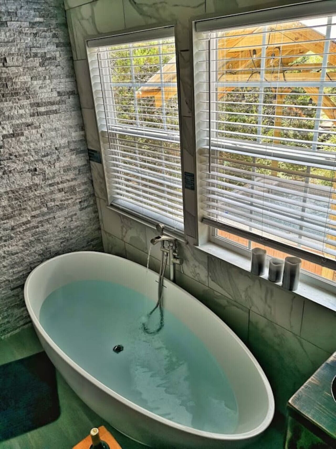 Bathtub, hair dryer, bathrobes, towels