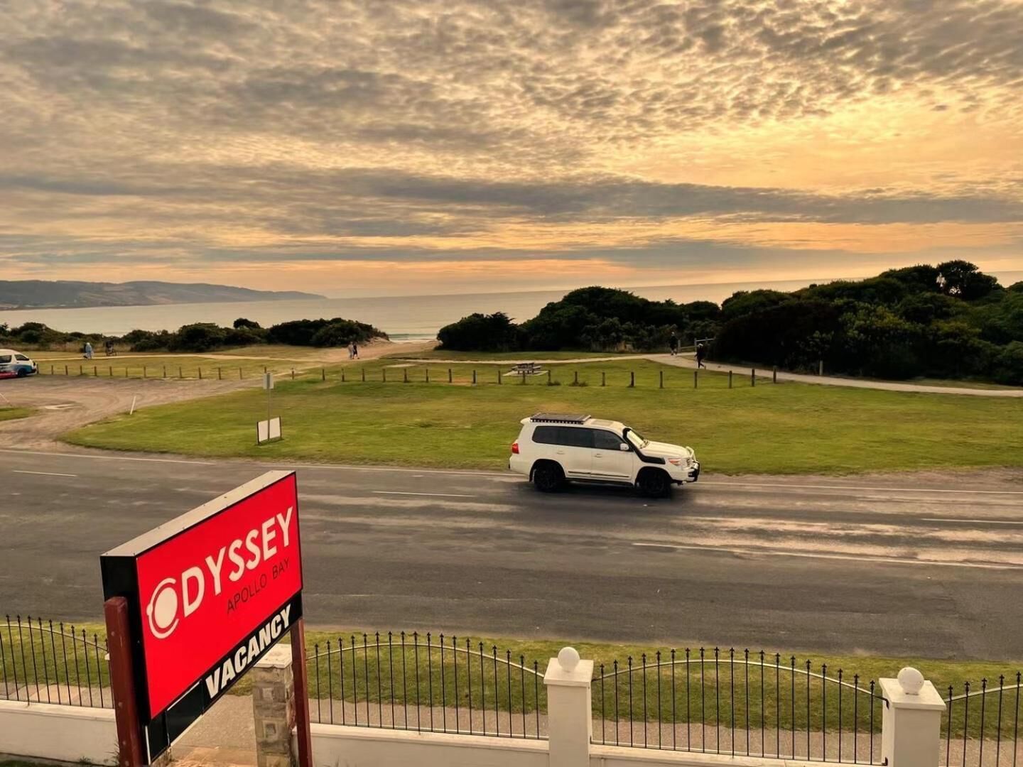 A sign for Odyssey Apollo Bay indicating a vacancy.