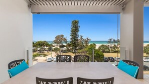 A balcony with a view of the beach and ocean. - OCEAN VIEWS @ NOR NOR EAST 201 (KINGSCLIFF)