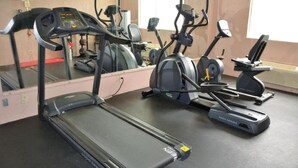 A gym with treadmills, elliptical machines, and a stationary bike. - Buckeye Inn Express (Columbus)
