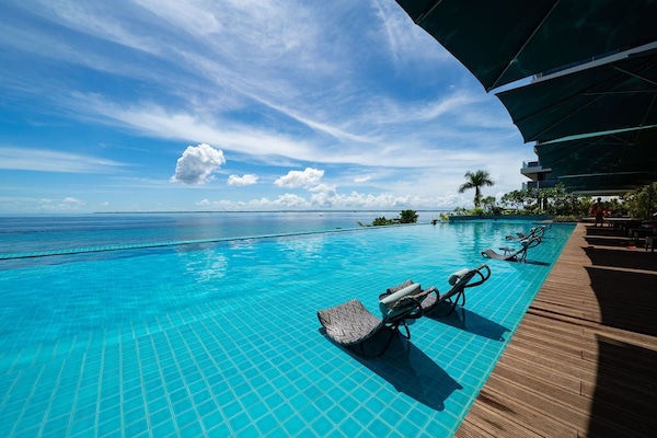 2 outdoor pools, open 6:00 AM to 9:00 PM, pool umbrellas, pool loungers