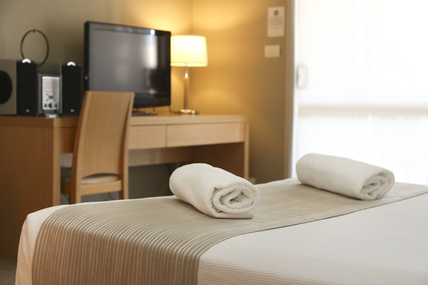 Studio Suite | Premium bedding, desk, laptop workspace, blackout drapes