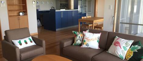 Standard Room, Sea View | Living room | Flat-screen TV