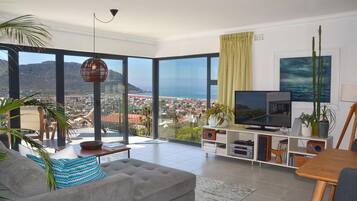 House | Living room | 55-inch TV with satellite channels