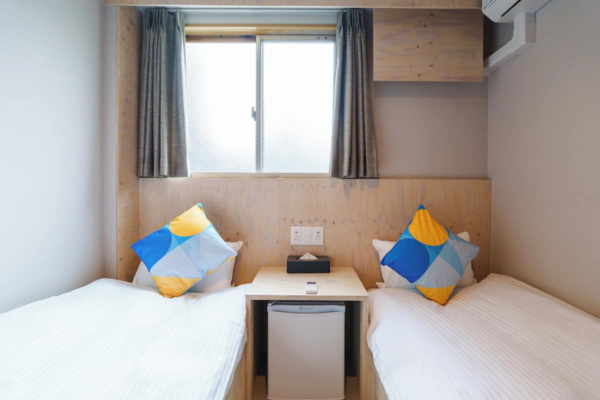 Standard Twin Room Non-Smoking (Shared Shower) | Blackout curtains, free WiFi, bed sheets