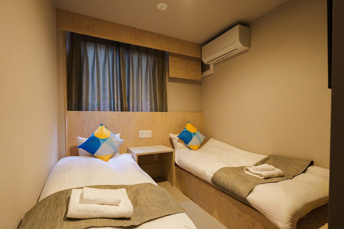 Standard Twin Room Non-Smoking (Shared Shower) | 1 bedroom, blackout drapes, free WiFi, bed sheets