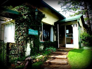 A building with a sign reading "Walkerbout Inn" and a covered entrance.
