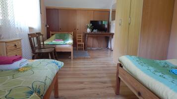 Triple Room, Shared Bathroom | Blackout curtains, iron/ironing board, free cots/infant beds