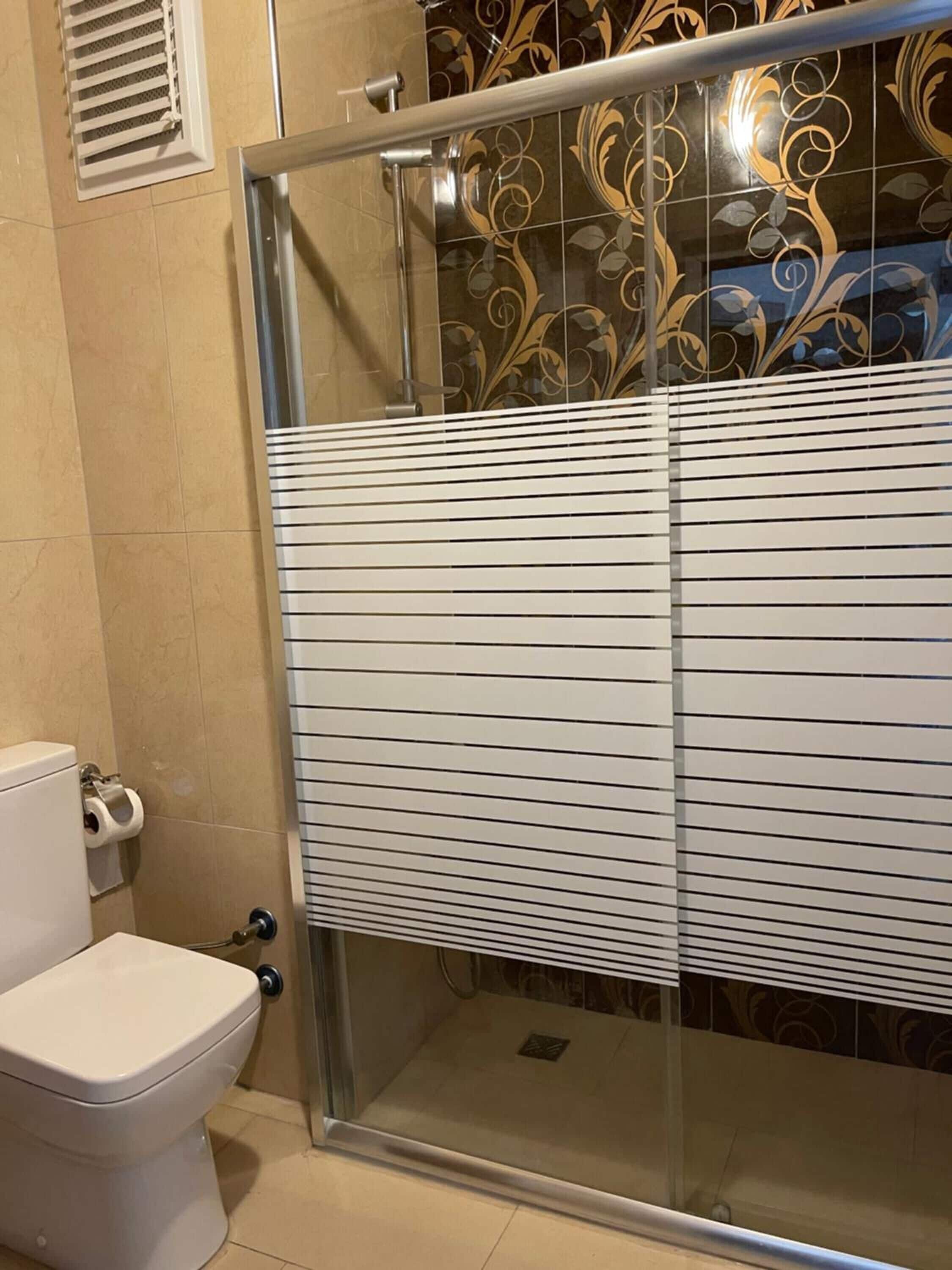 Shower, hair dryer, slippers, towels