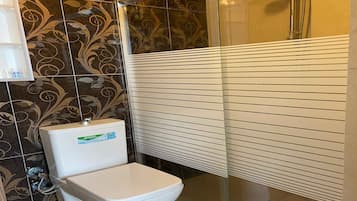 Shower, hair dryer, slippers, towels