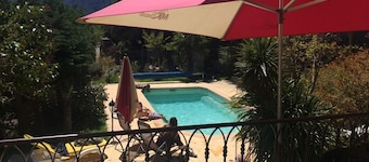 superb villa village center exceptional view. Swimming pool and wooded grounds.