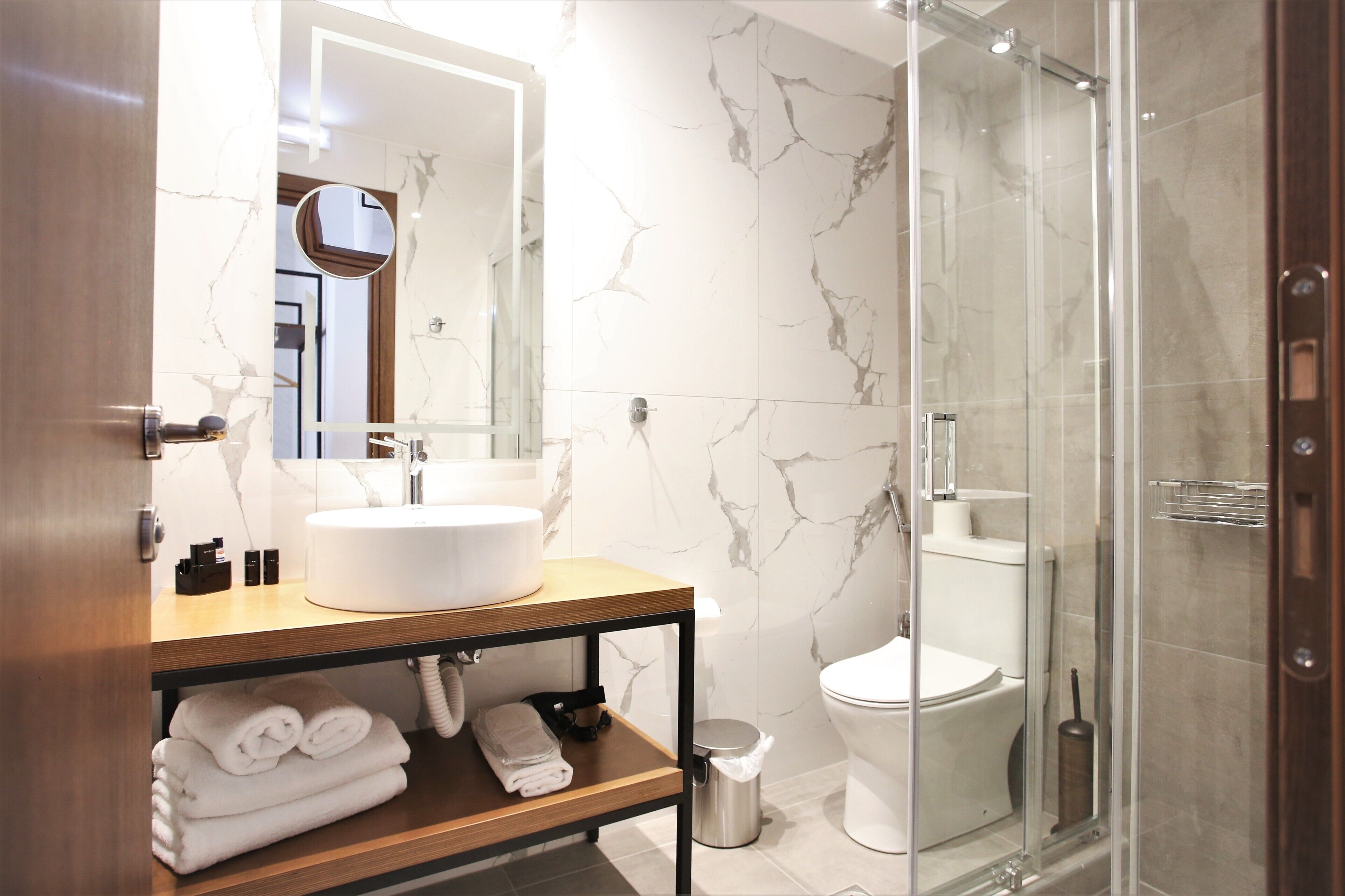 Designer toiletries, hair dryer, towels