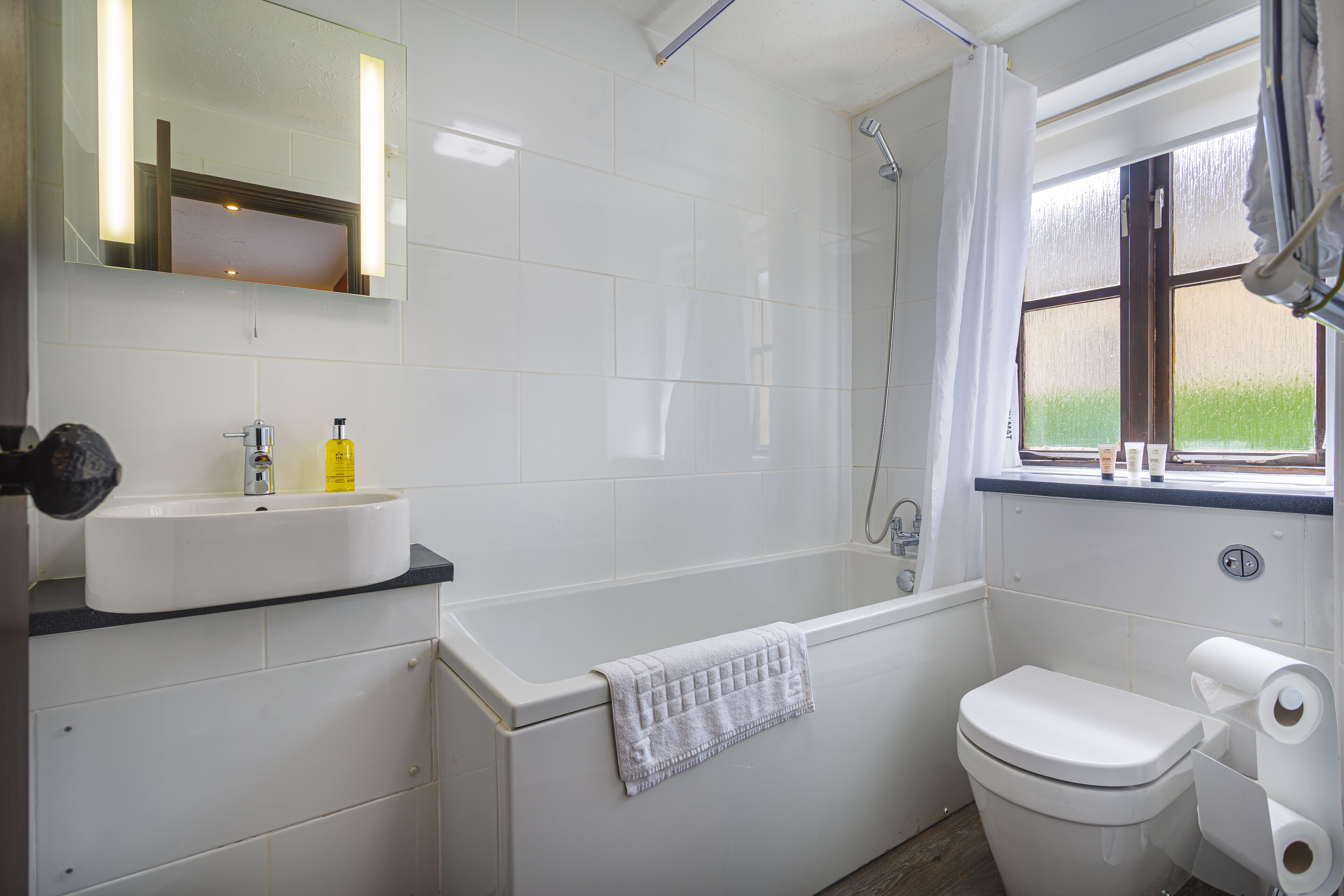 superior family room | bathroom | free toiletries, hair dryer, bathrobes, slippers