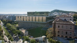A modern building with a flat roof and a large glass facade. - New Acropolis Museum Flat (Athens)