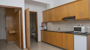 Apartment, 1 Bedroom | Private kitchenette | Fridge, stovetop, electric kettle, cookware/dishes/utensils
