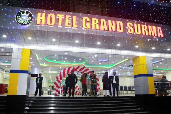 The entrance of Hotel Grand Surma with a prominent sign and a decorative archway. - Hotel Grand Surma (Sylhet)