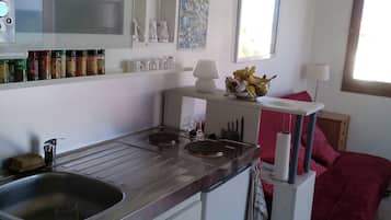 Fridge, microwave, stovetop, coffee/tea maker