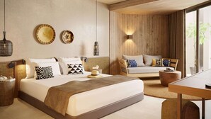 Habitación de hotel moderna con una cama grande, un sofá, una mesa de comedor y vistas a zonas verdes.